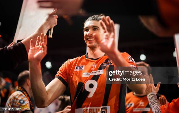 Timothee Carle from the BR Volleys claps with the fans and celebrates the victory after the Handball Bundesliga semifinal match between BR Volleys...