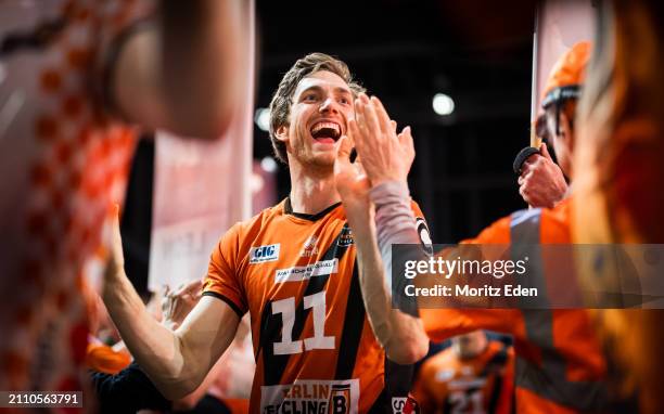 Cody Kessel from the BR Volleys claps with the fans and celebrates the victory after the Handball Bundesliga semifinal match between BR Volleys and...