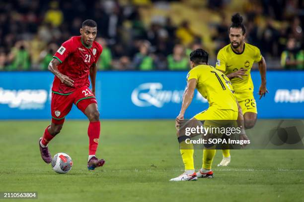 Abdul Rahman Al Mushaifri of Oman and Brenda Gan , Corbin Ong of Malaysia in action during the 2026 World Cup/2027 Asian Cup Qualifiers Group D match...