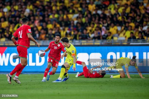 Dion Cools of Malaysia and Jameel Al Yahmadi of Oman in action during the 2026 World Cup/2027 Asian Cup Qualifiers Group D match between Malaysia and...
