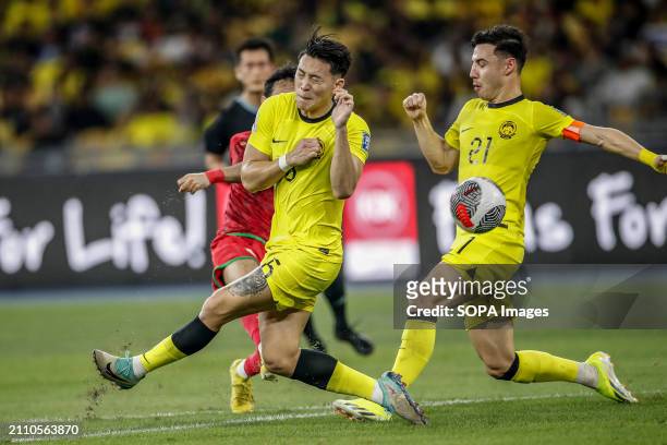 Dominic Tan and Dion Cools of Malaysia in action during the 2026 World Cup/2027 Asian Cup Qualifiers Group D match between Malaysia and Oman at the...