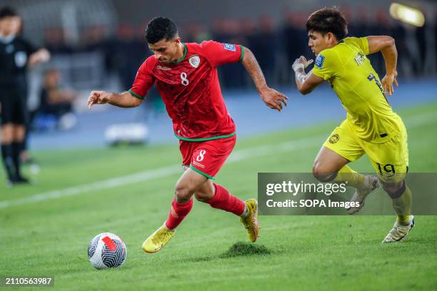 Zahir Sulaiman Al Aghbari and Akhyar Rashid of Malaysia in action during the 2026 World Cup/2027 Asian Cup Qualifiers Group D match between Malaysia...