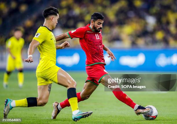 Muhsen Saleh Al Ghassani of Oman and Dominic Tan of Malaysia in action during the 2026 World Cup/2027 Asian Cup Qualifiers Group D match between...
