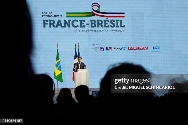 France's President Emmanuel Macron delivers a speech during the France-Brazil Economic Forum at the Federation of Industries of the State of Sao...