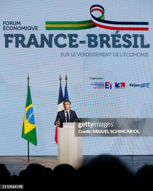 France's President Emmanuel Macron delivers a speech during the France-Brazil Economic Forum at the Federation of Industries of the State of Sao...