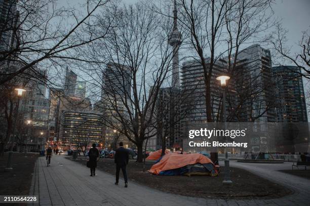 The unhoused find shelter in makeshift tent encampments at Clarence Square park in Toronto, Ontario, Canada, on Wednesday, Feb. 21, 2024. Toronto is...