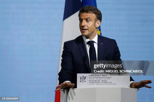 France's President Emmanuel Macron delivers a speech during the France-Brazil Economic Forum at the Federation of Industries of the State of Sao...