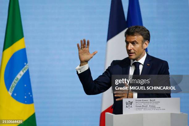 France's President Emmanuel Macron delivers a speech during the France-Brazil Economic Forum at the Federation of Industries of the State of Sao...