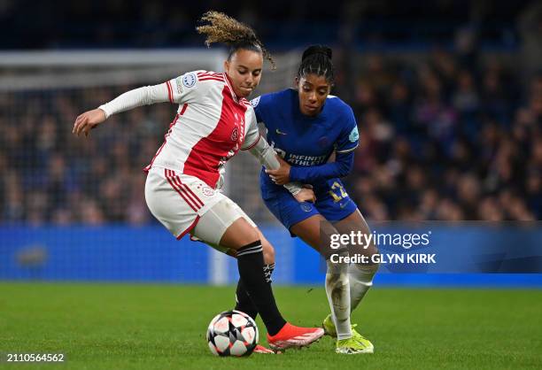 Chelsea's Canadian defender Ashley Lawrence vies with Ajax's Dutch striker Chasity Grant during the UEFA Women's Champions League quarter-final...