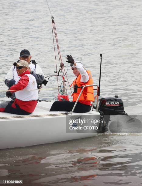 Track cycling Olympic champion Zhong Tianshi takes part in a parade along the Huangpu River as the "captain" of the J80 Sailing yacht during the 2024...