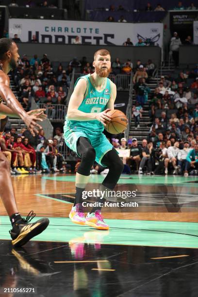 Davis Bertans of the Charlotte Hornets handles the ball during the game on March 27, 2024 at Spectrum Center in Charlotte, North Carolina. NOTE TO...