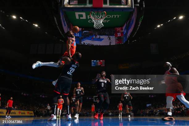 Isaiah Joe of the Oklahoma City Thunder dunks the ball during the game against the Houston Rockets on March 27, 2024 at Paycom Arena in Oklahoma...