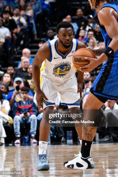 Andrew Wiggins of the Golden State Warriors plays defense during the game against the Orlando Magic on March 27, 2024 at Amway Center in Orlando,...