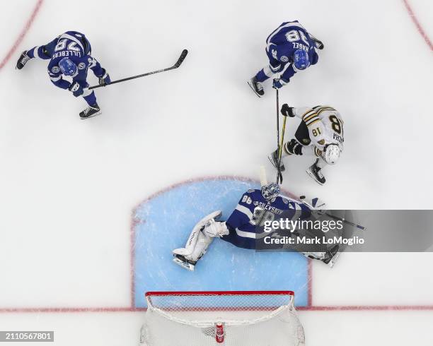 Goalie Andrei Vasilevskiy of the Tampa Bay Lightning stretches to make a save against Pavel Zacha of the Boston Bruins during the second period at...