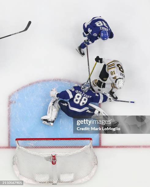 Goalie Andrei Vasilevskiy of the Tampa Bay Lightning stretches to make a save against Pavel Zacha of the Boston Bruins during the second period at...