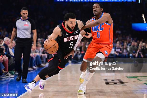 Fred VanVleet of the Houston Rockets drives against Jalen Williams of the Oklahoma City Thunder during the first half at Paycom Center on March 27,...