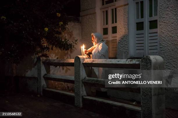 Catholic women dressed in white sheets take part in the Terno das Almas procession in Igatu on the Chapada Diamantina National Park, Bahia State,...