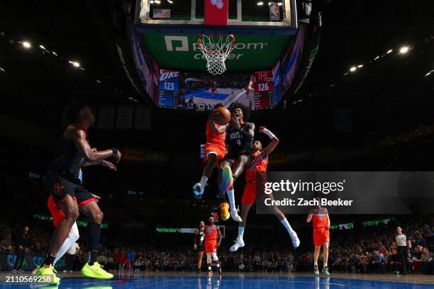 Jalen Green of the Houston Rockets drives to the basket during the game against the Oklahoma City Thunder on March 27, 2024 at Paycom Arena in...