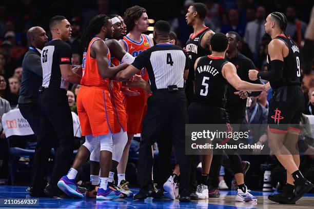 Josh Giddey of the Oklahoma City Thunder and teammates get into a scuffle with Fred VanVleet, Dillon Brooks and others of the Houston Rockets during...