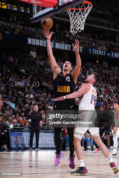 Nikola Jokic of the Denver Nuggets drives to the basket during the game against the Phoenix Suns on March 27, 2023 at the Ball Arena in Denver,...