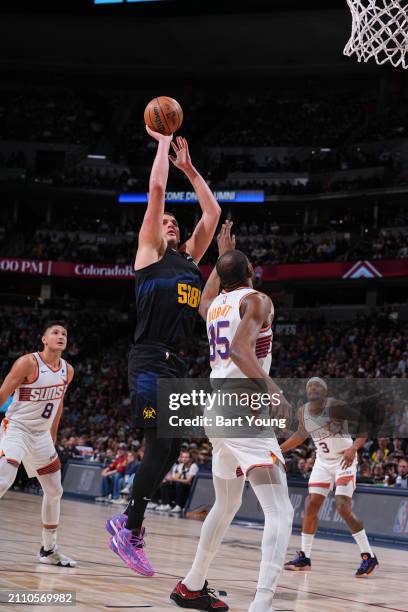 Nikola Jokic of the Denver Nuggets shoots the ball during the game on March 27, 2024 at the Ball Arena in Denver, Colorado. NOTE TO USER: User...