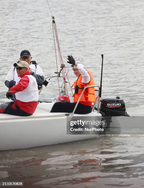 Track cycling Olympic champion Zhong Tianshi is taking part in a parade along the Huangpu River as the ''captain'' of the J80 Sailing yacht during...