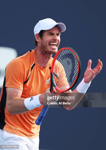 Andy Murray of Great Britain reacts after a lost point against Tomas Machac of the Czech Republic on Day 9 of the Miami Open at Hard Rock Stadium on...