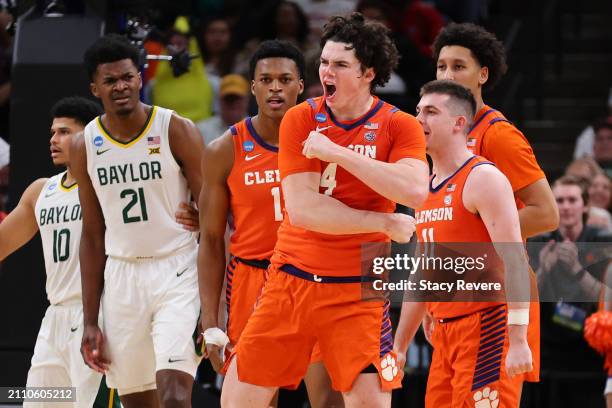 Ian Schieffelin of the Clemson Tigers reacts in front of Yves Missi of the Baylor Bears during the second half in the second round of the NCAA Men's...