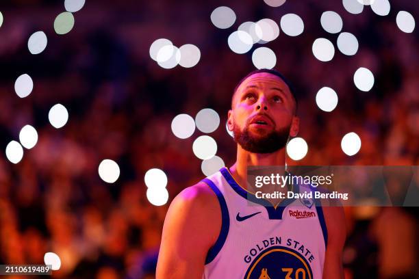 Stephen Curry of the Golden State Warriors looks on prior to the start of the game against the Minnesota Timberwolves at Target Center on March 24,...