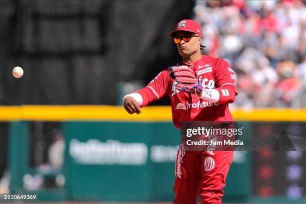 Robinson Cano of Diablos Rojos del Mexico throws the ball in the second inning during Spring Training Game One between Diablos Rojos and New York...