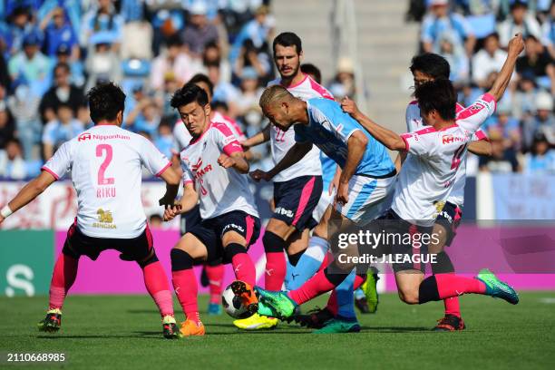 Kengo Kawamata of Júbilo Iwata competes for the ball against Cerezo Osaka defense during the J.League J1 match between Júbilo Iwata and Cerezo Osaka...