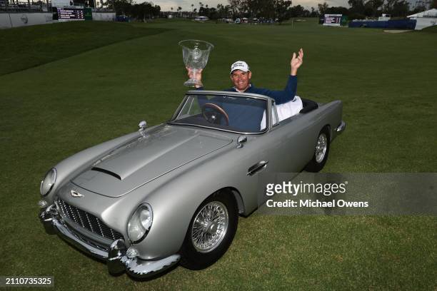 Padraig Harrington of Ireland poses for a photo with the winners trophy in a miniature Aston Martin during the final round of the Hoag Classic...