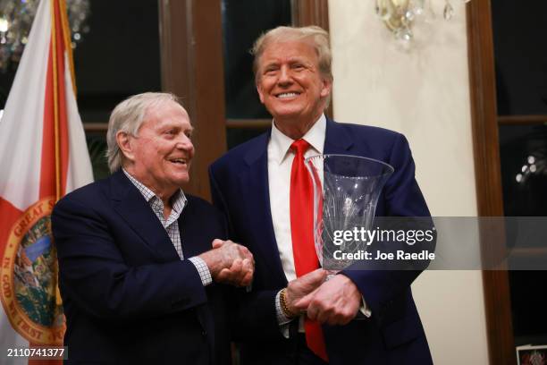 Retired professional golfer Jack Nicklaus presents Republican presidential candidate and former President Donald Trump with the 2024 Trump...