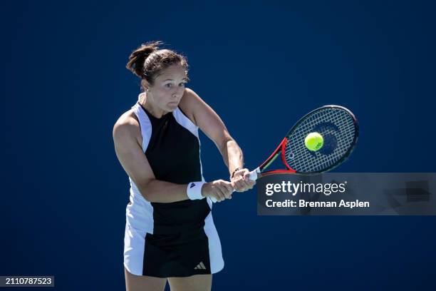 Daria Kasatkina hits a shot against Sorana Cirstea of Romania during their match at Hard Rock Stadium on March 24, 2024 in Miami Gardens, Florida.