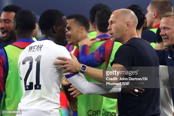 United States head coach Gregg Berhalter celebrates with Tim Weah of the United States during the first half against Mexico in the Concacaf Nations...