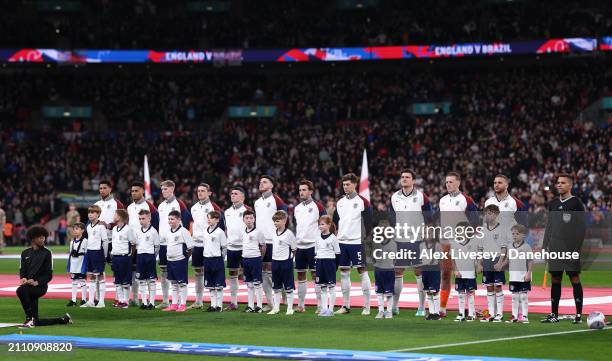 The players of England line up for the national anthem prior to the international friendly match between England and Brazil at Wembley Stadium on...