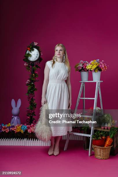 elegant woman  wearing white dress - giant rabbit stock pictures, royalty-free photos & images