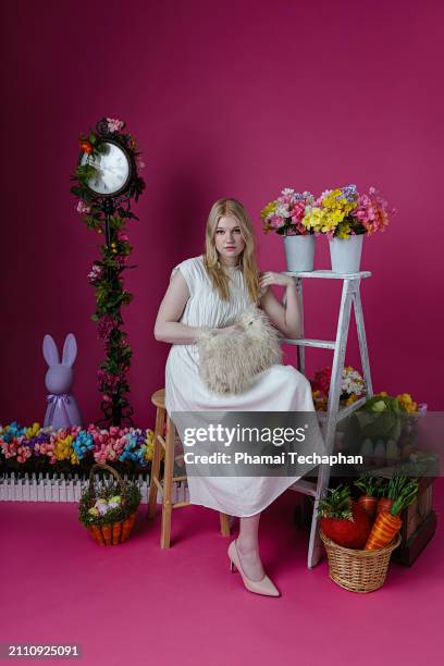 elegant woman  wearing white dress - giant rabbit stock pictures, royalty-free photos & images