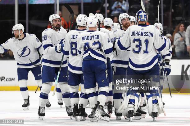 Jonas Johansson, Darren Raddysh, Tanner Jeannot, Nicholas Paul and Nick Perbix of the Tampa Bay Lightning celebrate after defeating the Anaheim Ducks...