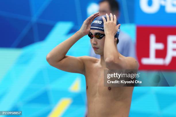 Shogo Takeda prepares to compete in the Men's 1500m Freestyle Final during day eight of the Swimming Olympic Qualifier at Tokyo Aquatics Centre on...