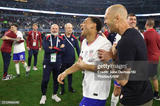 United States head coach Gregg Berhalter celebrates with Tyler Adams after defeating Mexico in the Concacaf Nations League Final at AT&T Stadium on...