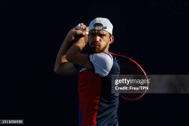 Tomas Machac of the Czech Republic hits a backhand against Andy Murray of Great Britain in the third round of the Miami Open at the Hard Rock Stadium...