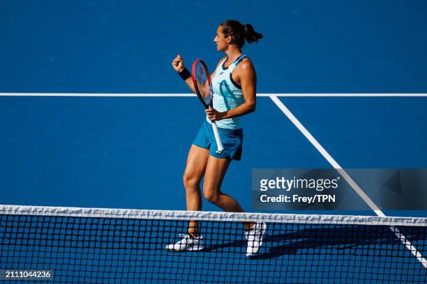Caroline Garcia of France celebrates against Naomi Osaka of Japan in the third round of the Miami Open at the Hard Rock Stadium on March 24, 2024 in...