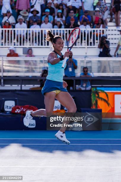 Caroline Garcia of France celebrates her victory over Naomi Osaka of Japan in the third round of the Miami Open at the Hard Rock Stadium on March 24,...