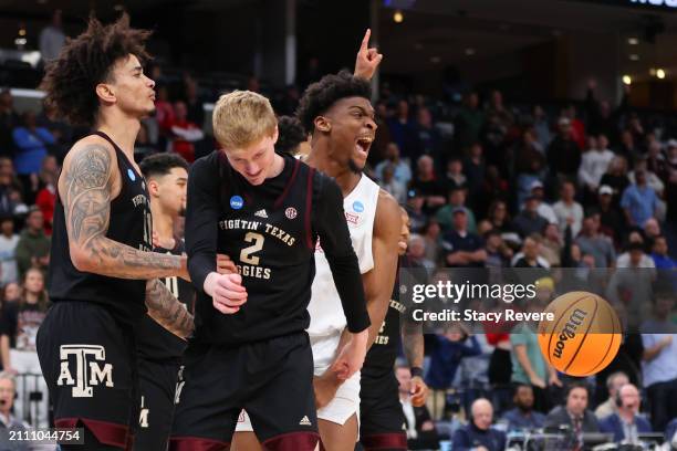 Andersson Garcia and Hayden Hefner of the Texas A&M Aggies react as Cedric Lath of the Houston Cougars celebrates at the end of overtime in the...