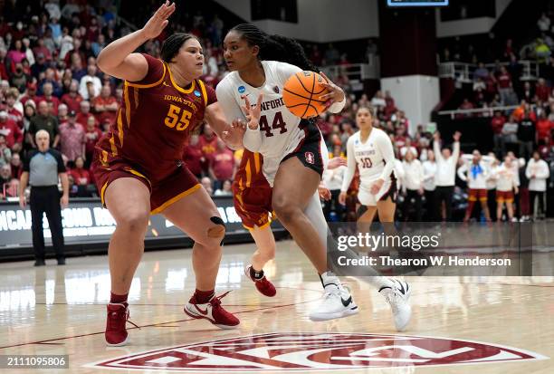 Kiki Iriafen of the Stanford Cardinal drives to the basket on Audi Crooks of the Iowa State Cyclones in overtime in the second round of the NCAA...