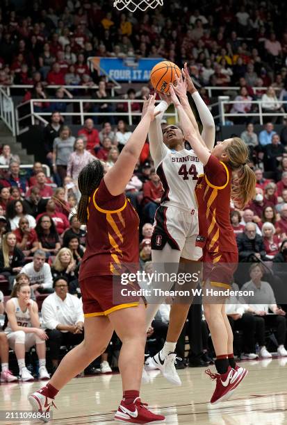 Kiki Iriafen of the Stanford Cardinal shoots and gets fouled by Audi Crooks of the Iowa State Cyclones in overtime in the second round of the NCAA...