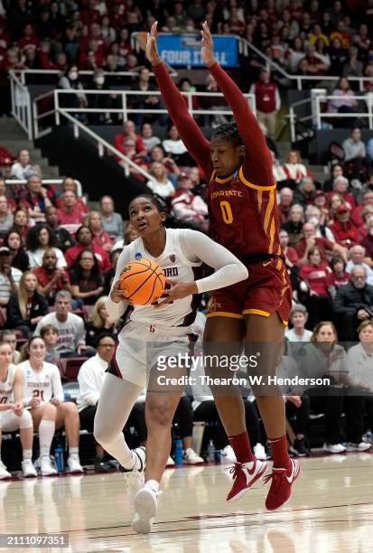 Kiki Iriafen of the Stanford Cardinal drives to the basket on Isnelle Natabou of the Iowa State Cyclones in overtime in the second round of the NCAA...