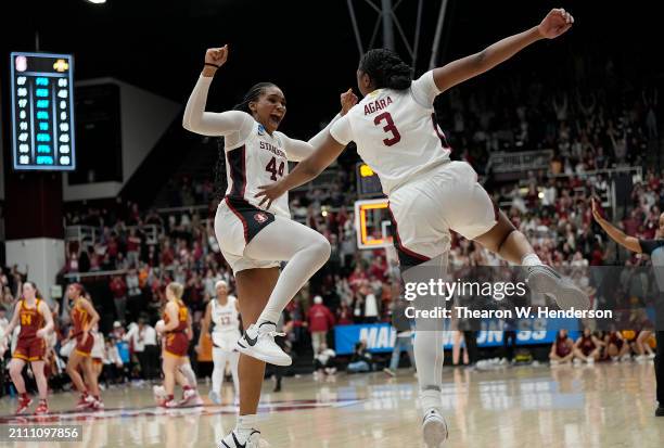 Kiki Iriafen and Nunu Agara of the Stanford Cardinal celebrates after they defeated the Iowa State Cyclones 87-81 in overtime in the second round of...