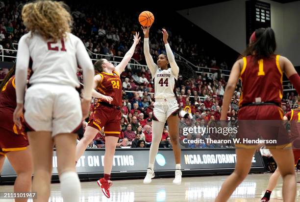 Kiki Iriafen of the Stanford Cardinal shoots over Addy Brown of the Iowa State Cyclones during the second half in the second round of the NCAA...